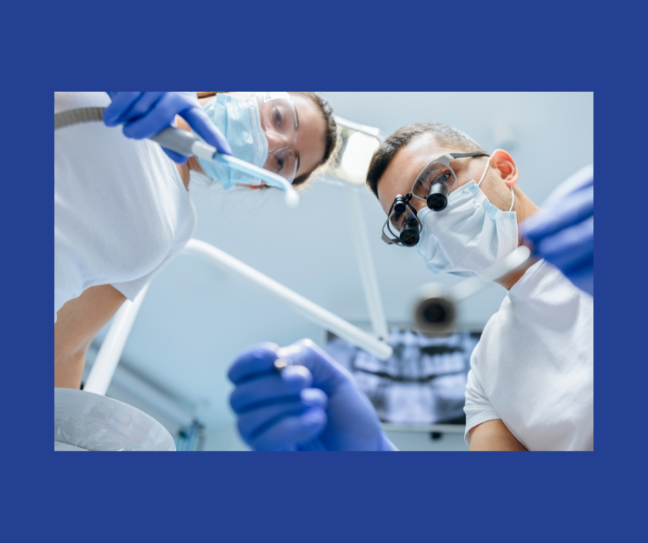 A man and a woman perform a dental examination in white shirts, blue gloves and blue face masks